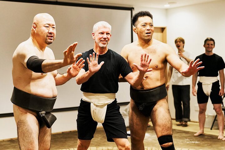 Sumo wrestlers performing at Sumo Studio Osaka