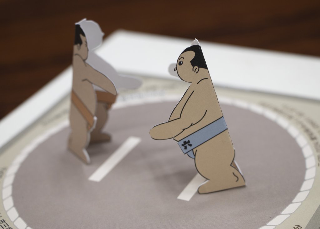 Sumo wrestlers in action at an Osaka venue