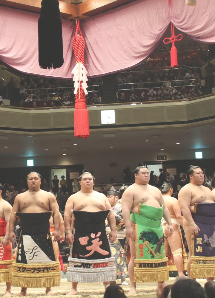 Sumo wrestler throwing purifying salt