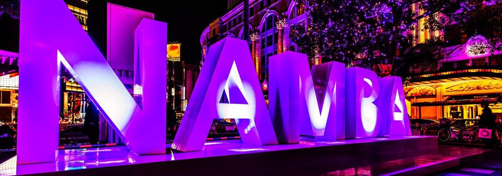 Happy family exploring things to do in Namba with kids