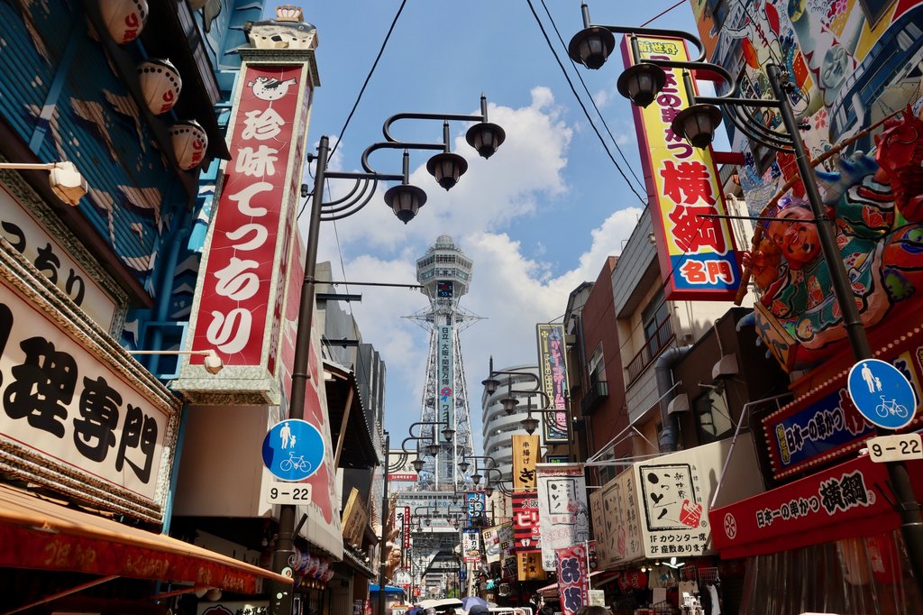 Tsutenkaku Tower and colorful signs in Shinsekai