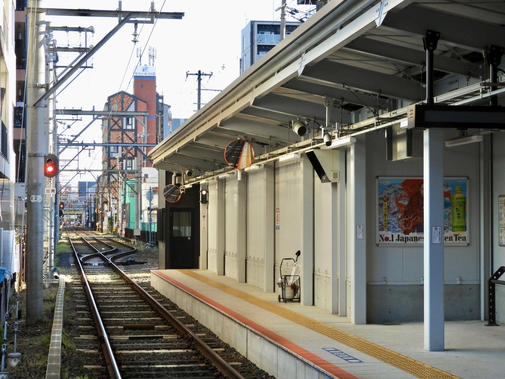 Tsutenkaku Tower illuminated at night in Shinsekai