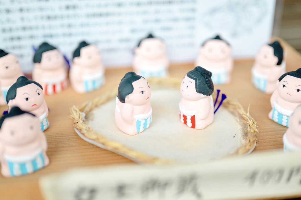 Sumo wrestlers eating chanko-nabe together