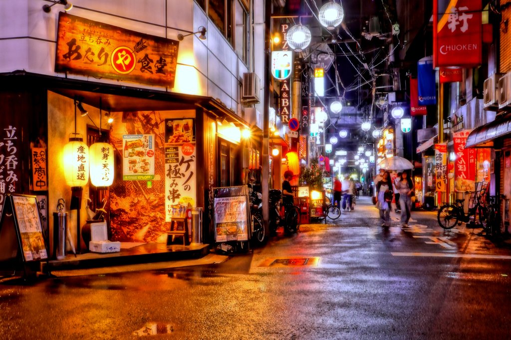 Neon-lit street scene in Osaka at night