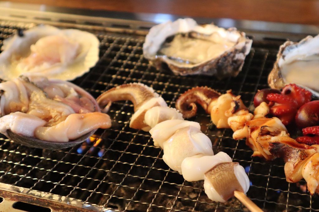Grilled seafood skewers at Kuromon Market