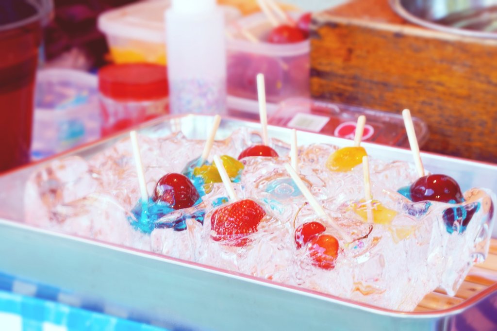 Colorful candied fruit on sticks