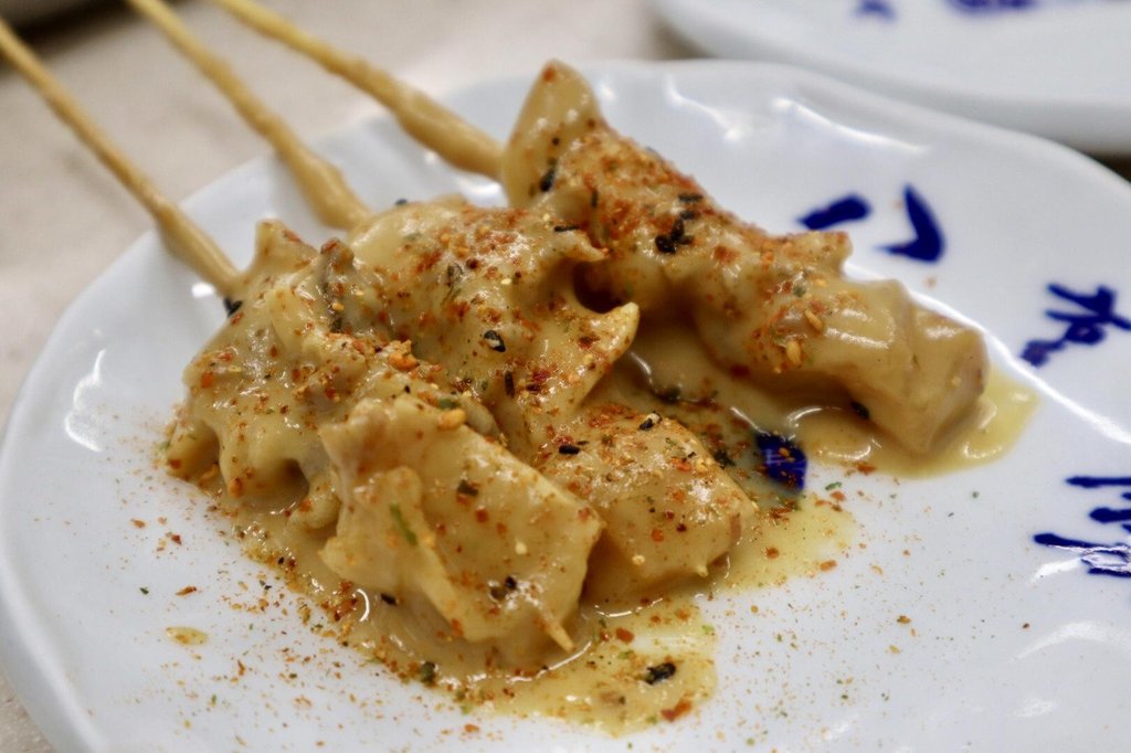 Dote-yaki beef tendon skewers simmering in miso
