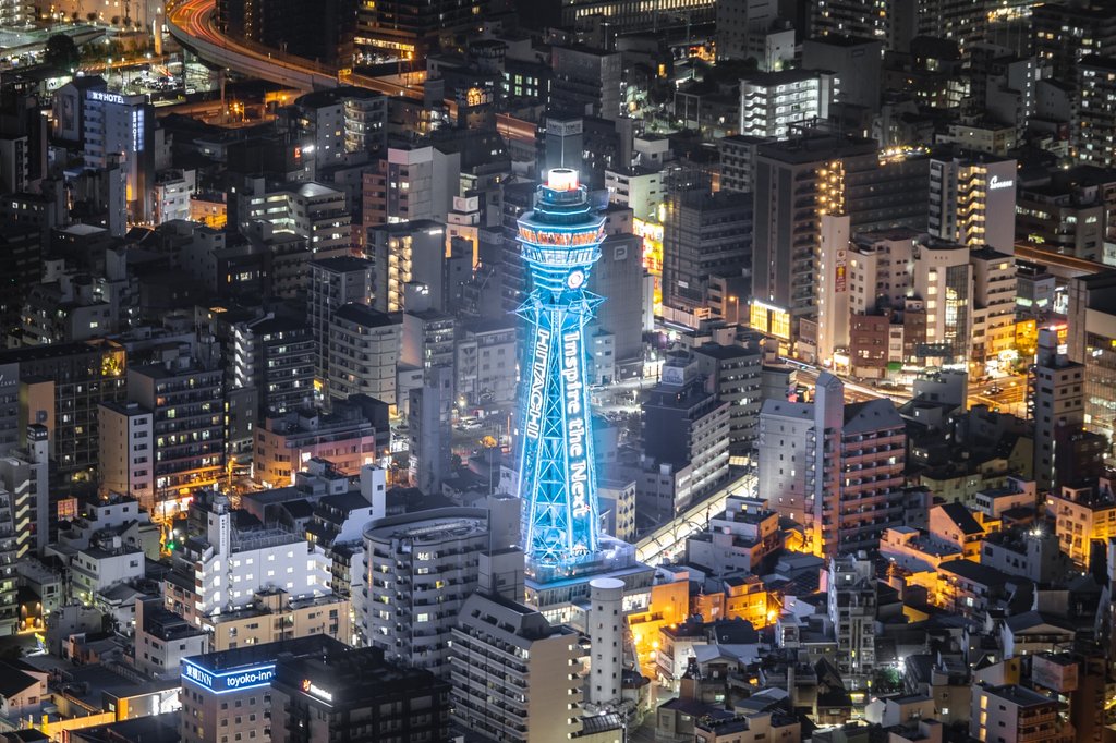 Shinsekai night scene with tourists