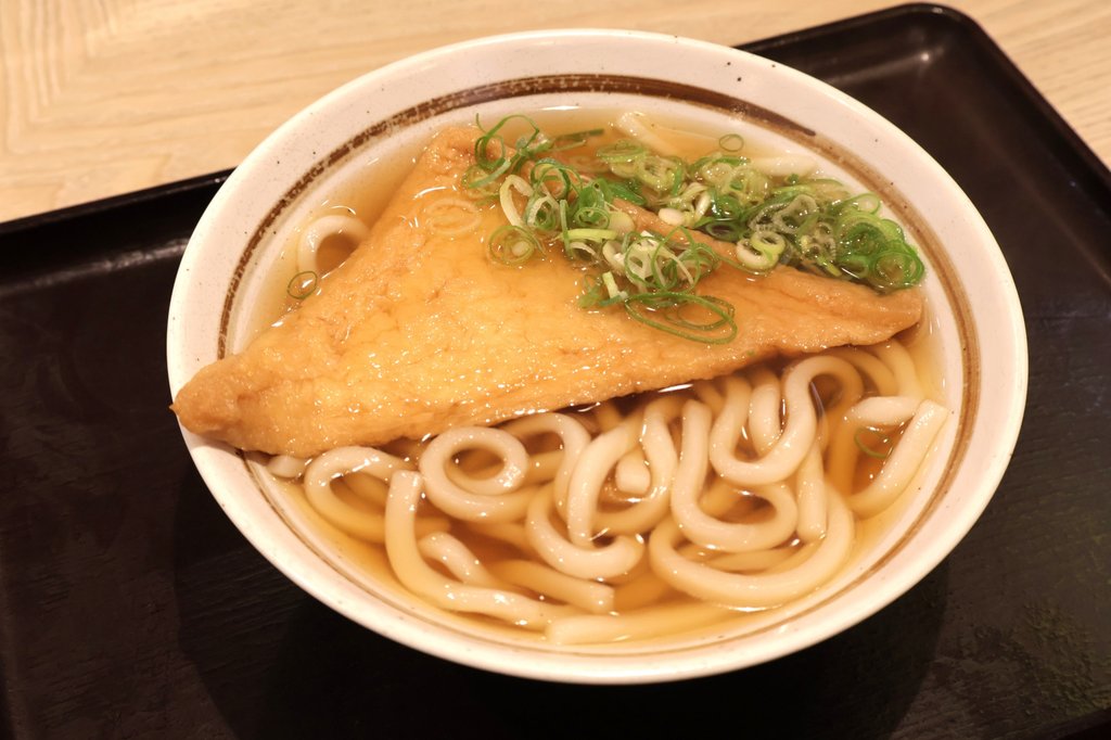 Kitsune udon noodles with fried tofu in Kansai-style broth