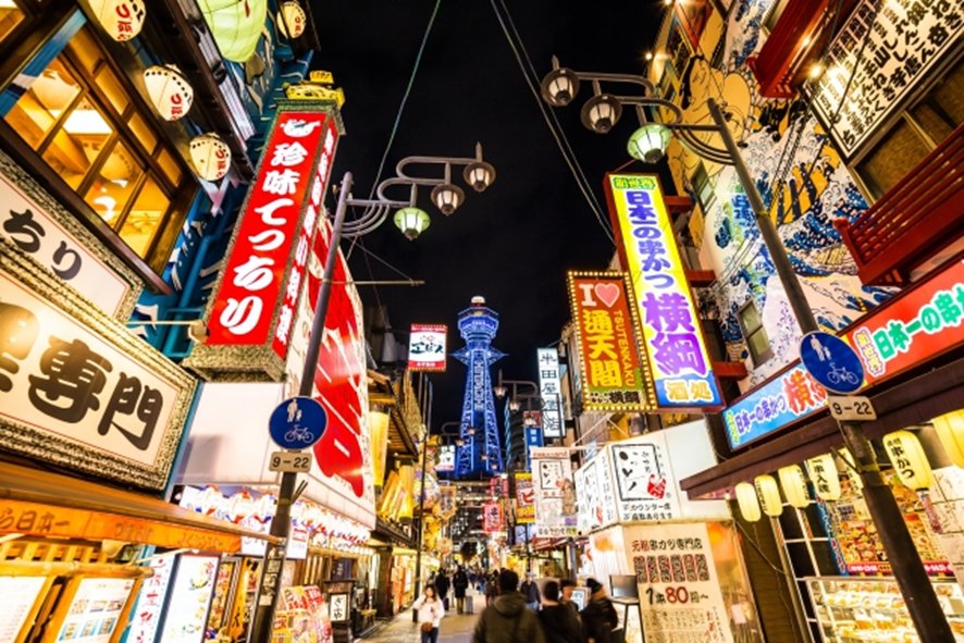 Nighttime osaka food tour through neon-lit streets