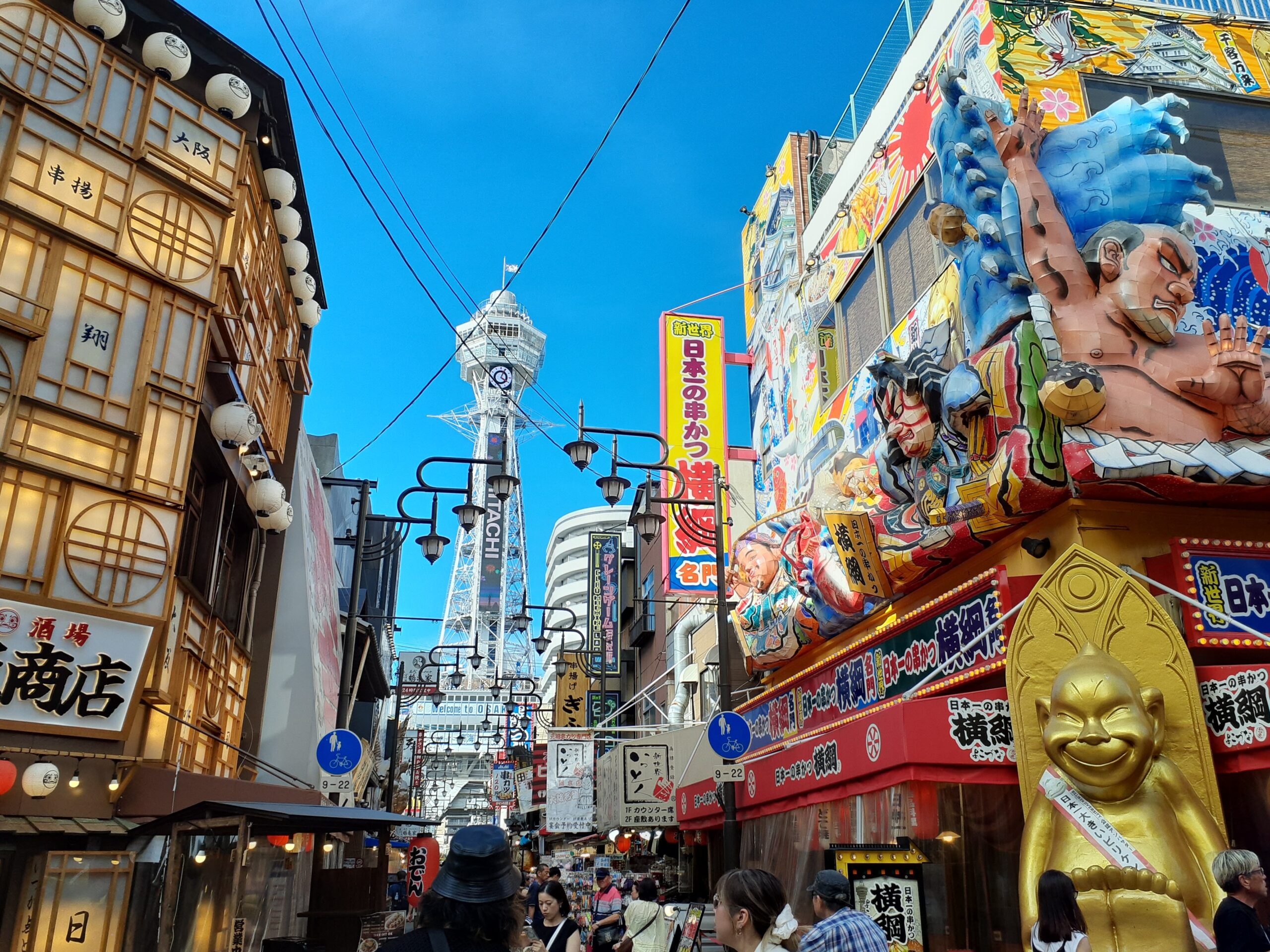 Kushikatsu Daruma Shinsekai main store with Tsutenkaku Tower, Osaka