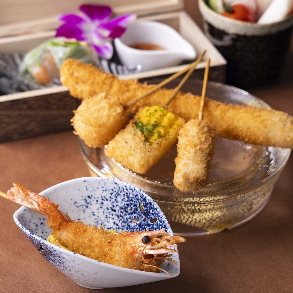 Chef preparing kushiage skewers at Harusai counter