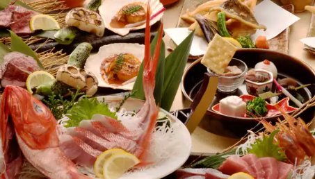 Sashimi platter and grilled skewers at Ura-Namba Sakaba Uoden