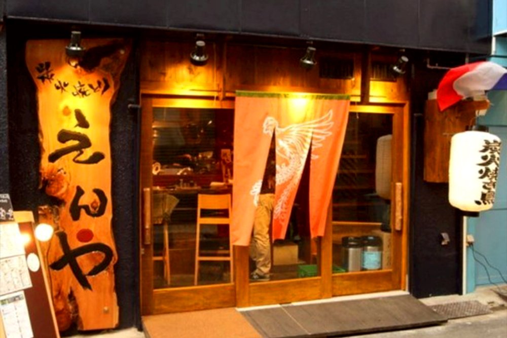 Yakitori being grilled over charcoal at Sumibiyakitori Enya